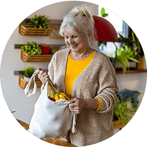 Older woman with a bag of produce