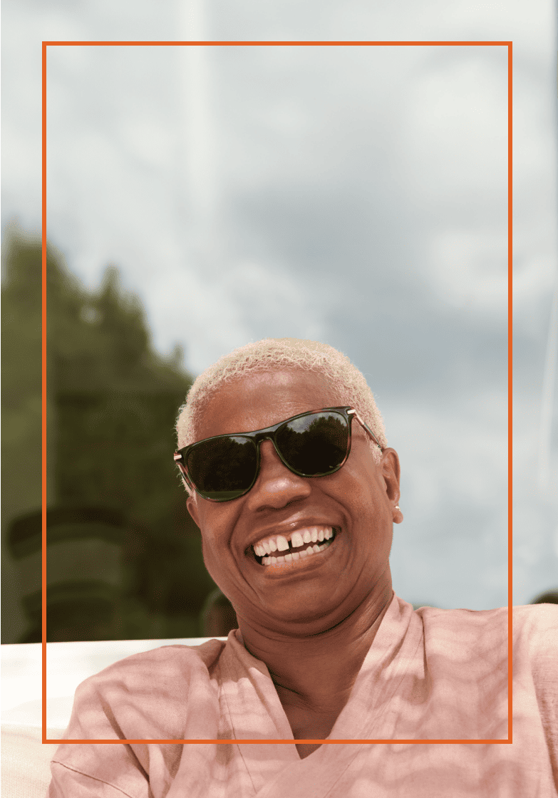 Older woman smiling while she is outdoors