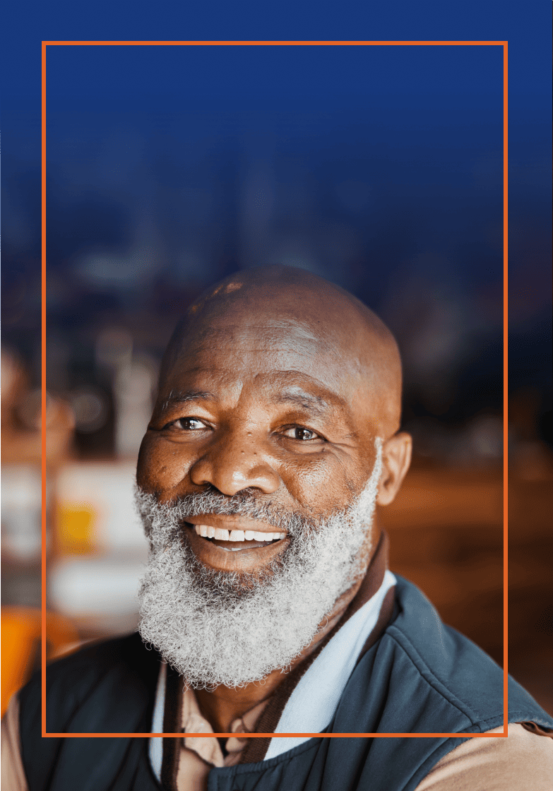 Smiling eldery man with full white beard