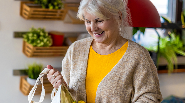 Older woman with a bag of produce
