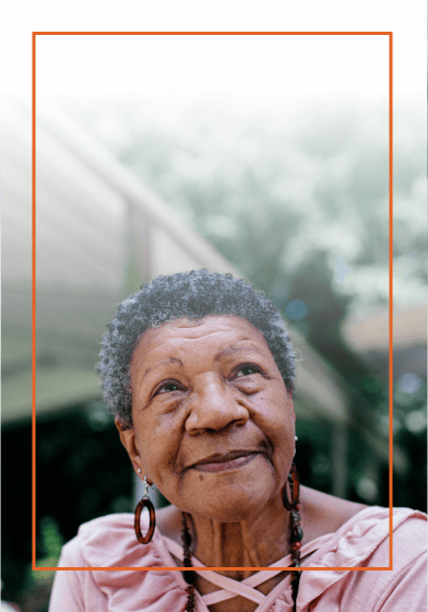 Elderly woman standing outside
