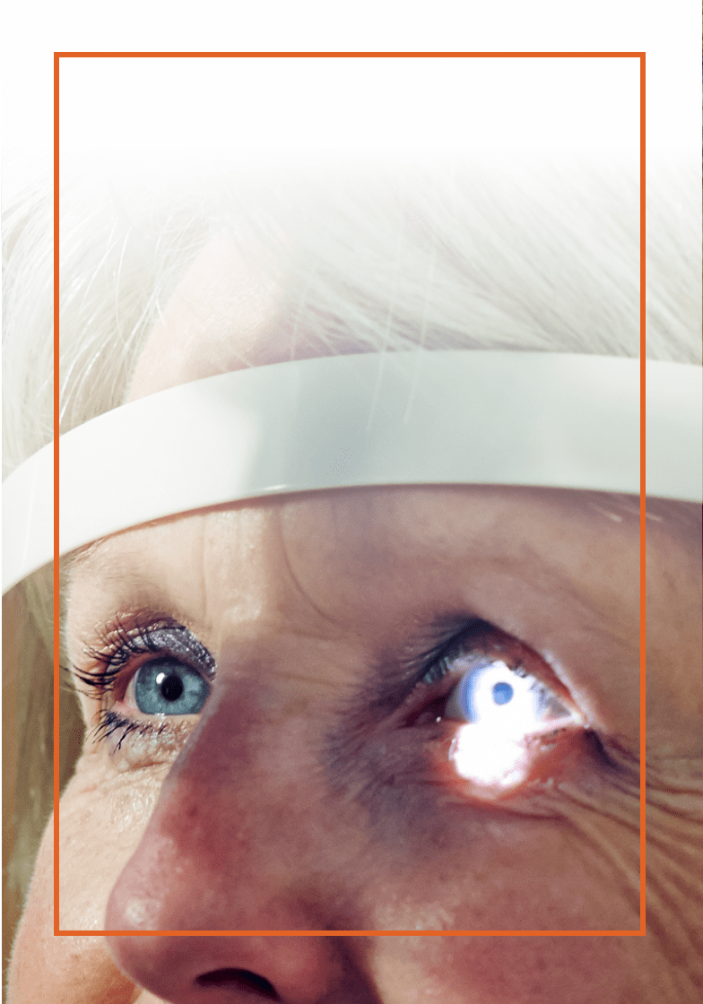 Close up of an older woman getting an eye exam