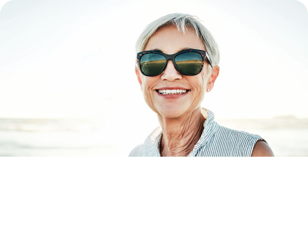 Older woman in sunglasses smiling