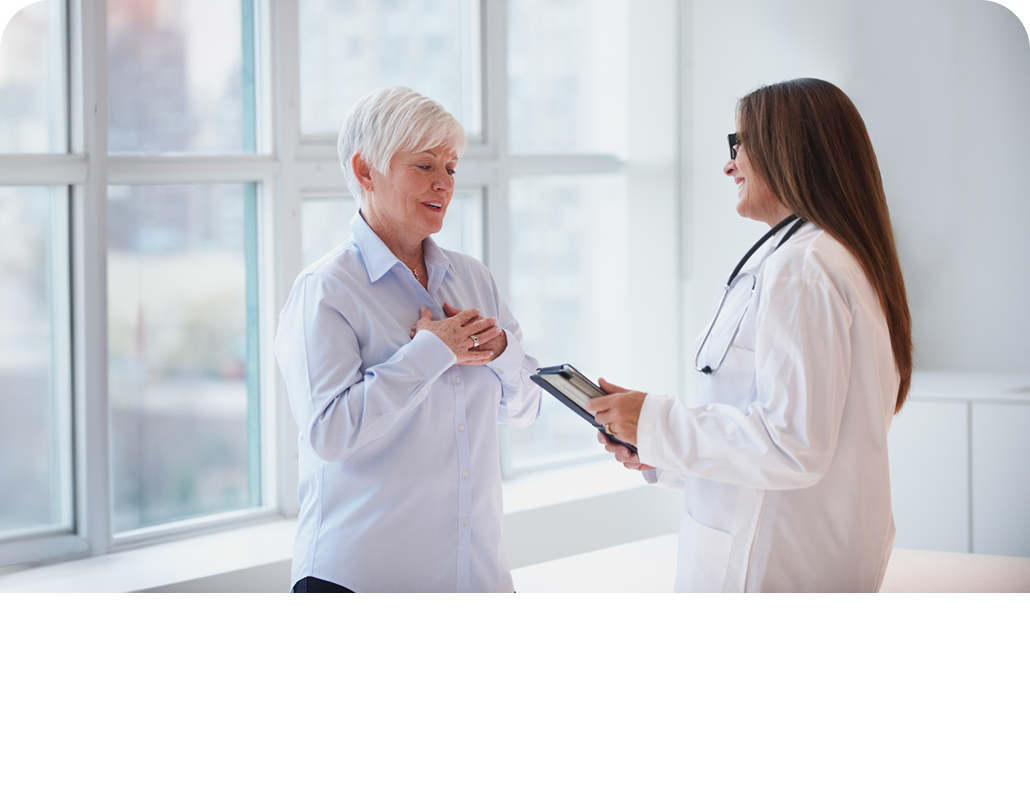 Older woman talking to her female doctor