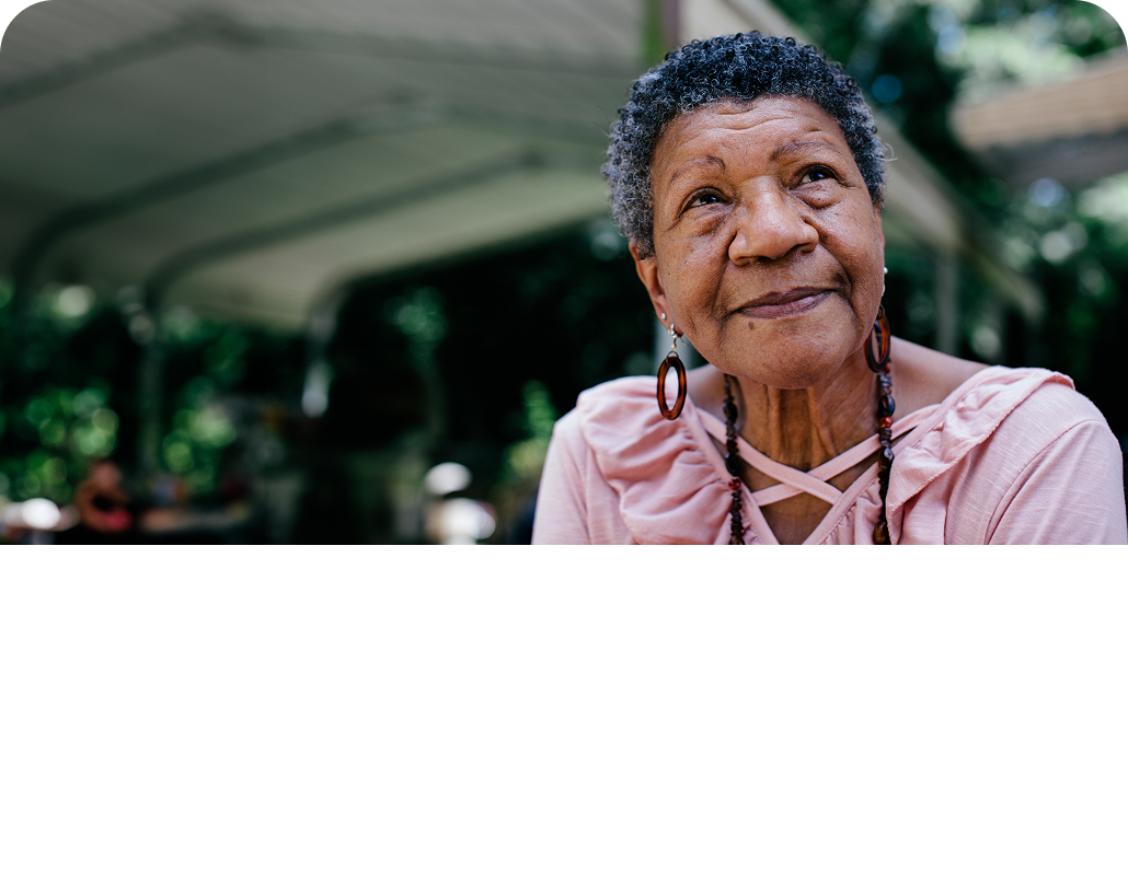 Elderly woman sitting outside