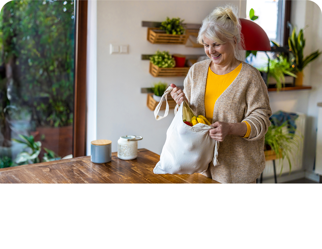 Older woman with a bag of produce