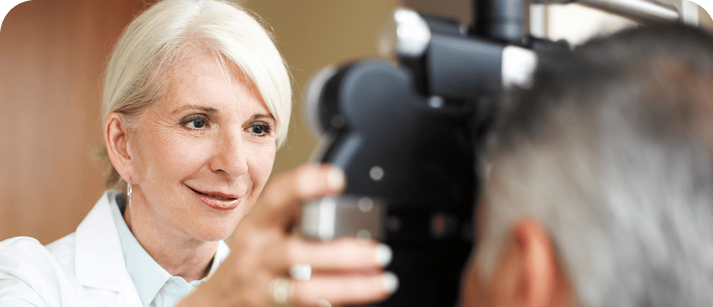 Female doctor performing an eye exam