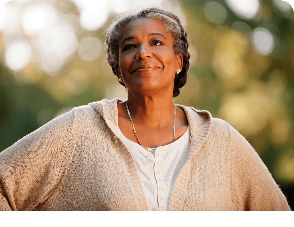 Older woman smiling while she is outside