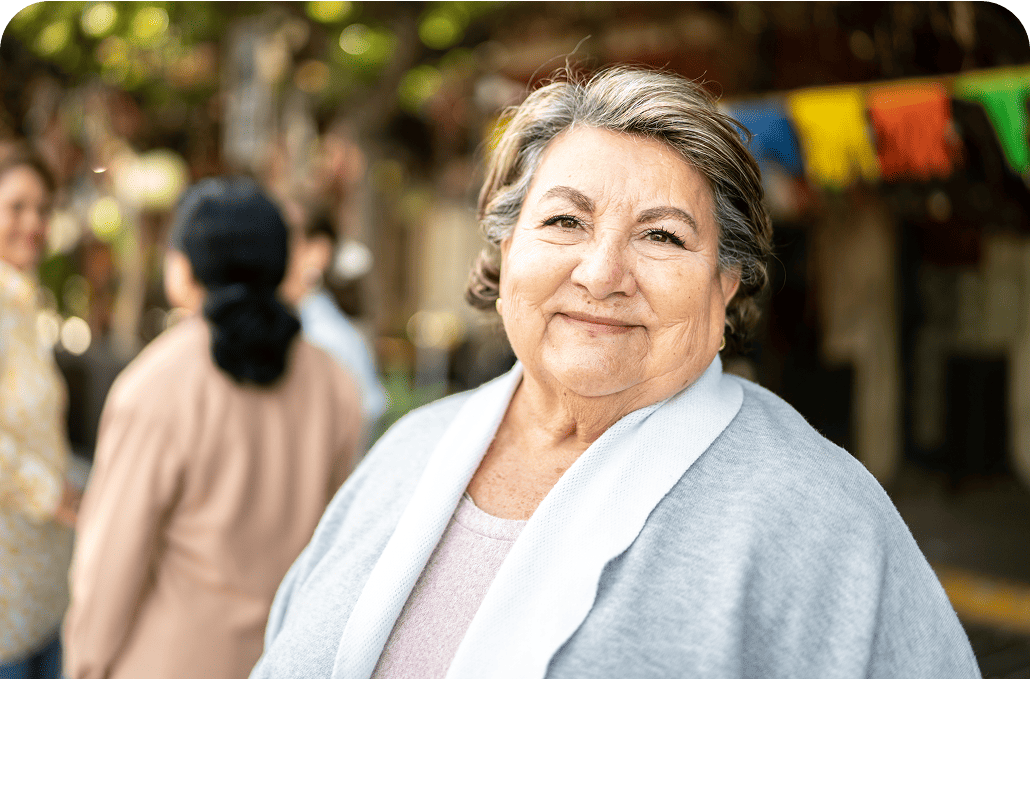 Older woman standing in front of a store